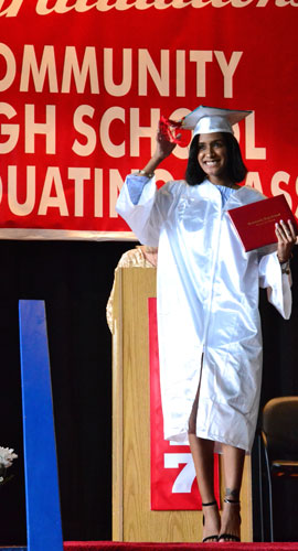 Student at graduation who just received diploma