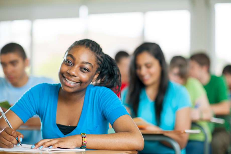 Smiling students at desk