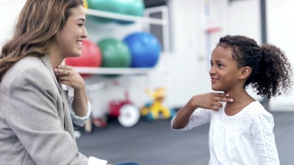 Teacher with child with dysgraphia